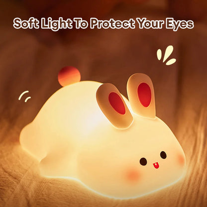 Night light with silicone big face in the form of rabbit, duck, panda, capybara, and pig. Rechargeable via USB