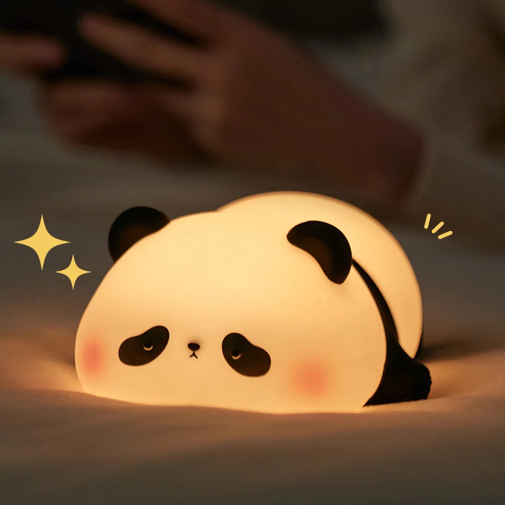 Night light with silicone big face in the form of rabbit, duck, panda, capybara, and pig. Rechargeable via USB