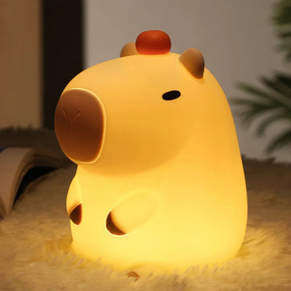 Night light with silicone big face in the form of rabbit, duck, panda, capybara, and pig. Rechargeable via USB