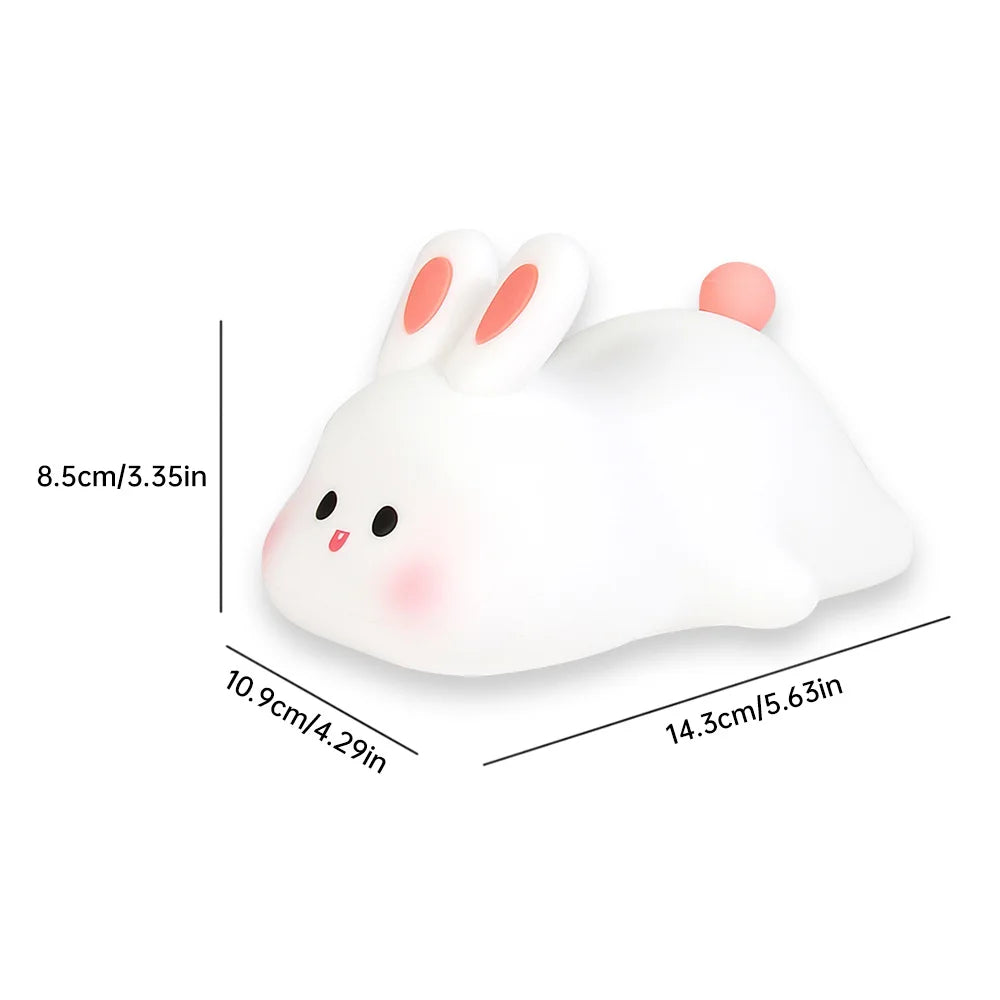 Night light with silicone big face in the form of rabbit, duck, panda, capybara, and pig. Rechargeable via USB