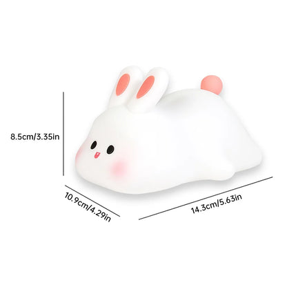 Night light with silicone big face in the form of rabbit, duck, panda, capybara, and pig. Rechargeable via USB