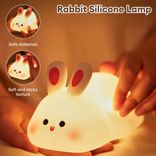 Night light with silicone big face in the form of rabbit, duck, panda, capybara, and pig. Rechargeable via USB