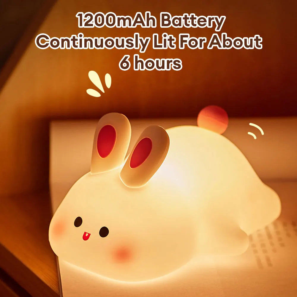 Night light with silicone big face in the form of rabbit, duck, panda, capybara, and pig. Rechargeable via USB